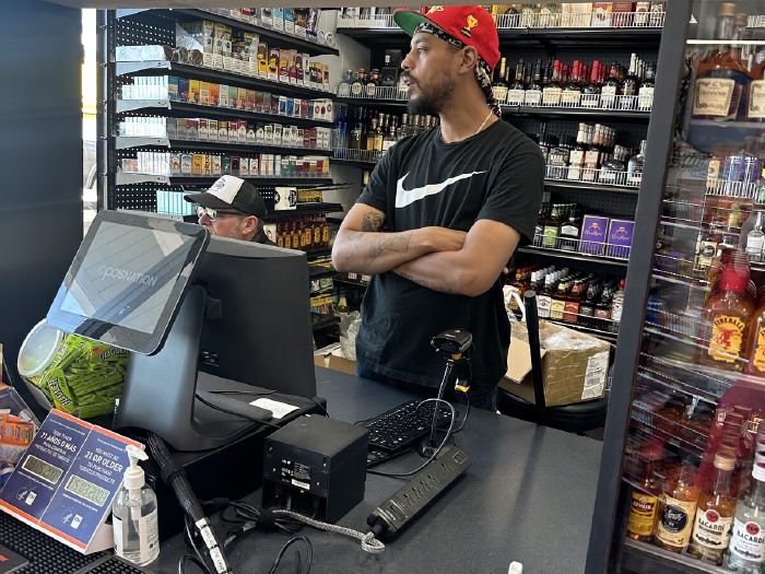 Friendly staff at the register at Fifty's Market & Liquor in Hayward
